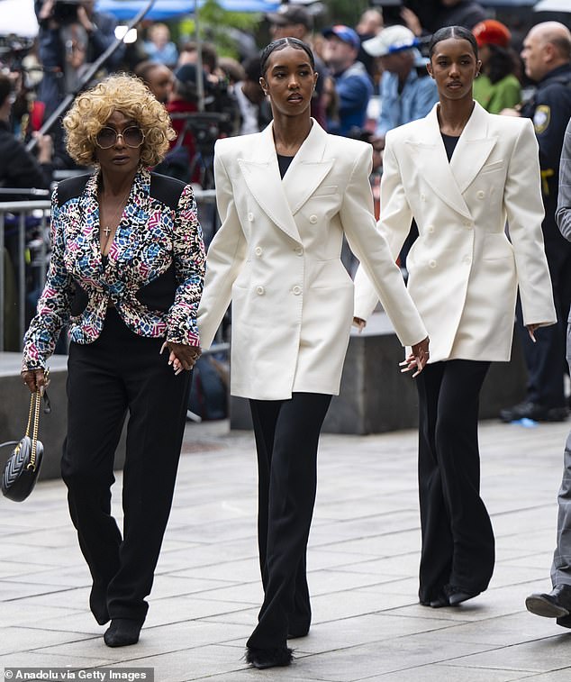 Sean Combs' mother Janice (left) walks into court with Combs' twin daughters Jessie and D'Lila. Insiders close to the family have revealed to Daily Mail how the young girls are 'disgusted' by the sexual testimonies