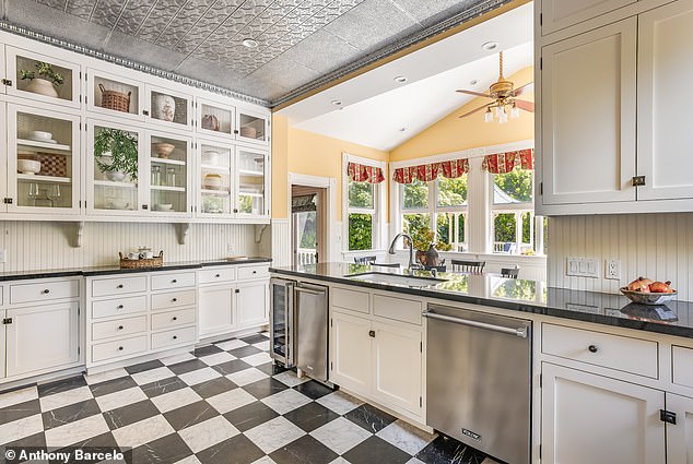 The chef's kitchen features Viking appliances, stone countertops and bright natural light