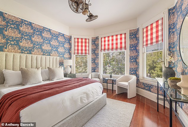 Lavish Victorian bedroom with wallpapered walls and detailed ceiling trim