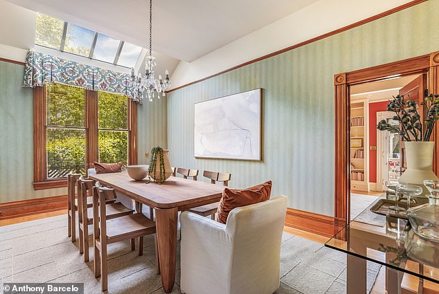 Formal dining room with intricate wainscoting and vintage chandelier