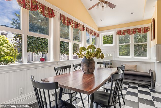 A breakfast room overlooking landscaped gardens