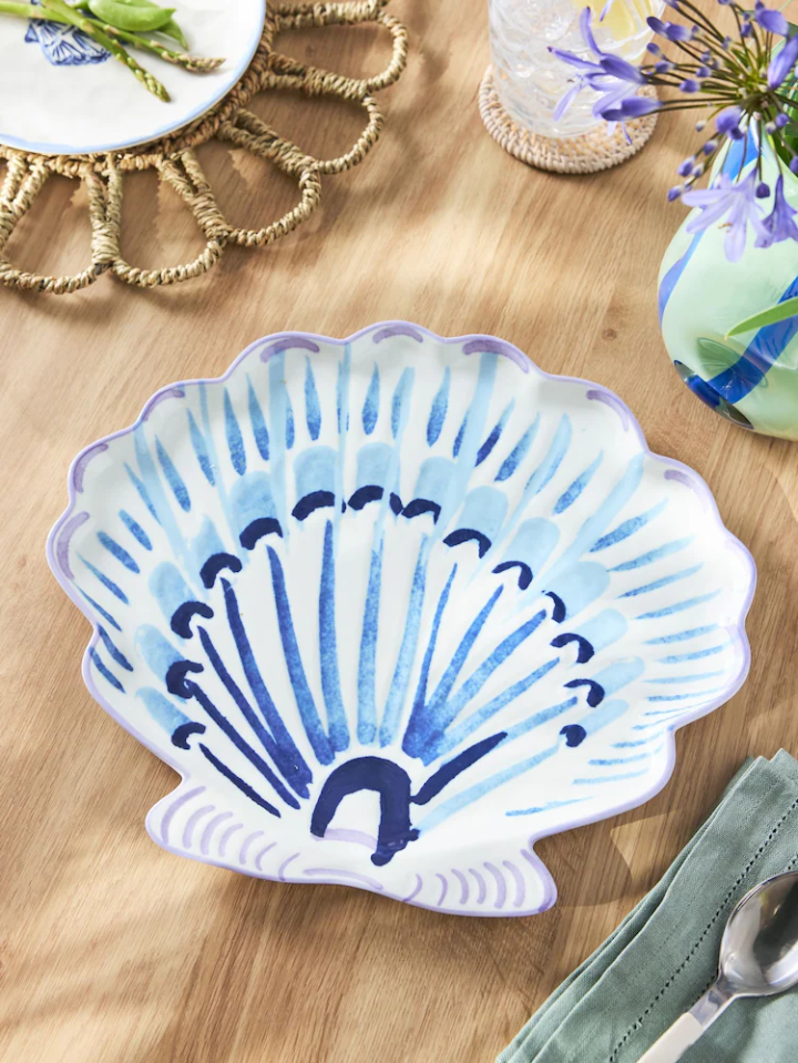 Shell-shaped serving platter with blue and white design.