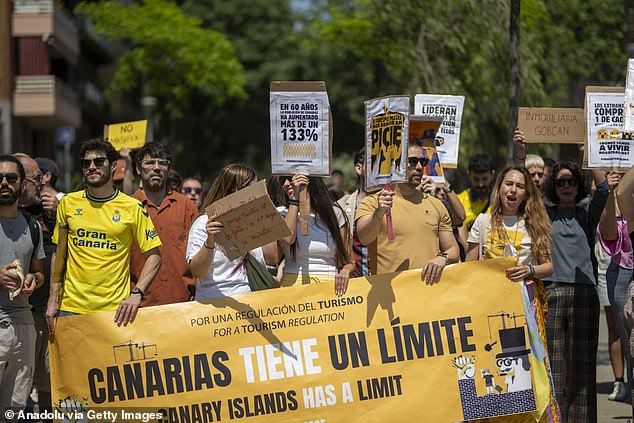 Around 50 people gather in front of the Sagrada Familia, Barcelona under the slogan 'Canarias tiene un limite' (The Canary Islands have a limit')