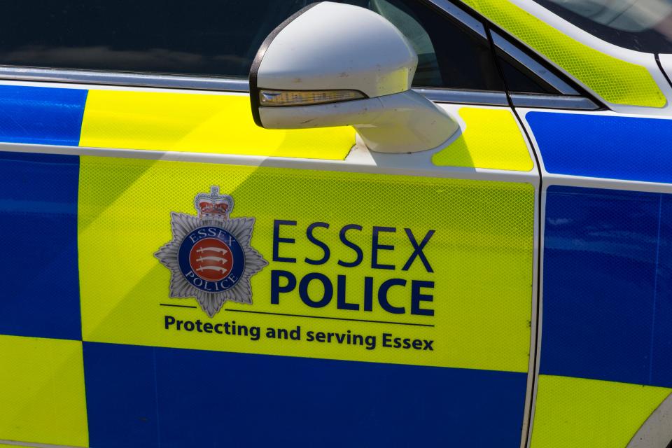 Essex Police car door with logo and text "Protecting and serving Essex".