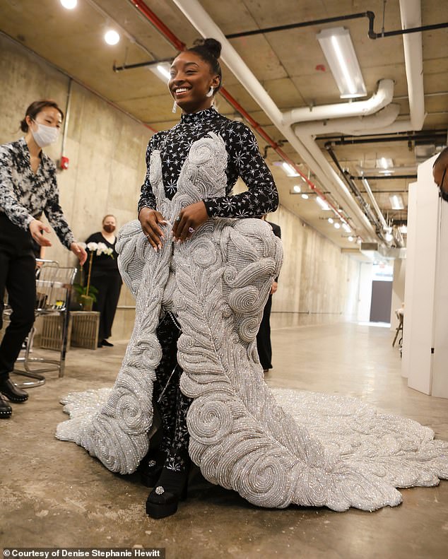 The then-19-year-old NYU sophomore had to silently contain her elation that a major publication wanted her to shoot the biggest fashion event of the year as she sat amongst nervous new students. She's the youngest to ever shoot the Met Gala (pictured: Biles at her final fitting, taken by Hewitt)