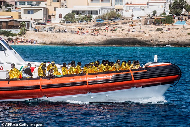 Migrants being brought to shore on the Italian island of Lampedusa on September 15, 2023