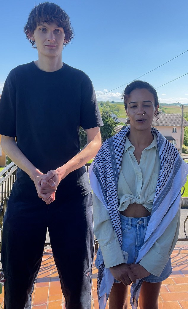 Video, as published by the Telegraph, captured the pair's (pictured) demonstration while singer Yuval Raphael performed New Day Will Rise at the St Jakobshalle arena
