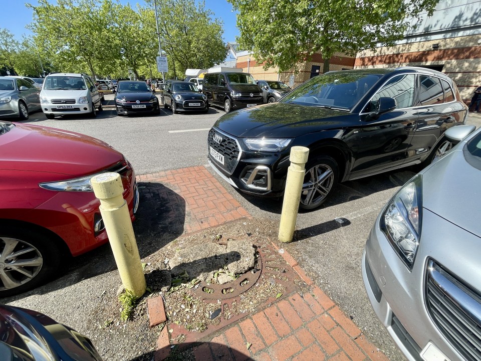 Car parked in a parking spot with a parking ticket.