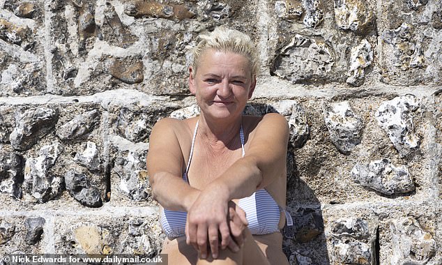 Jana Kalinova, 56, swims regularly at Brighton beach and advises to eat by a wall to prevent food being taken