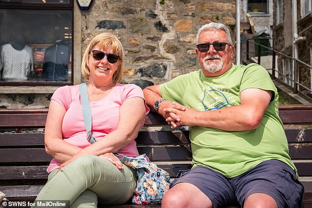 Sally Clayton, 62, said she was able to sit in her garden in nearby Hayle without being bothered by gulls - but the nightmare would start when she visited St Ives (pictured with husband Kevin)