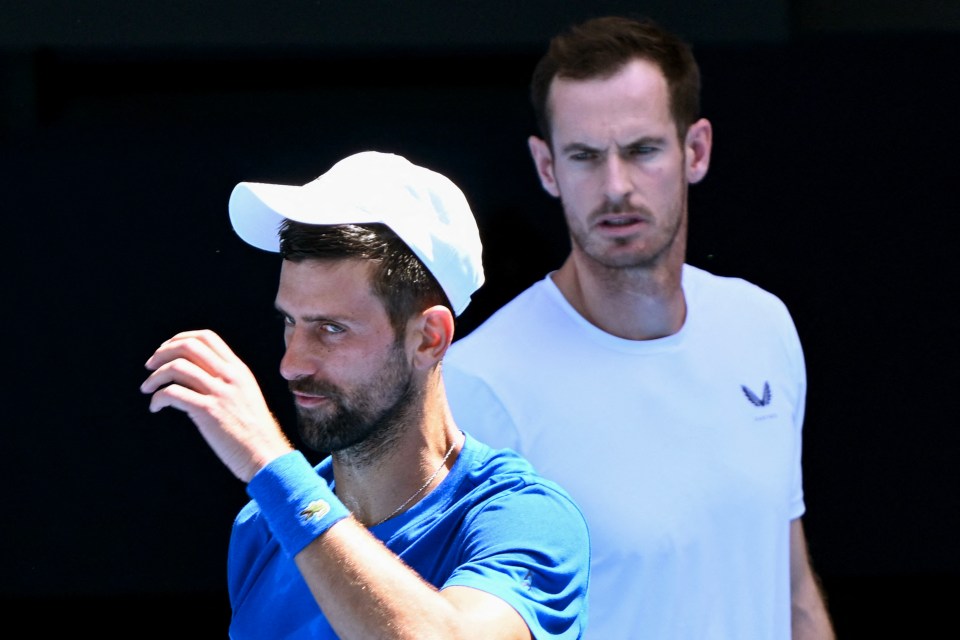 Novak Djokovic listening to coach Andy Murray at tennis training.