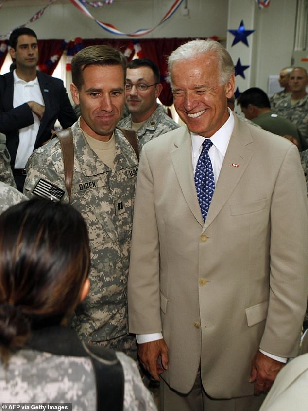 It was not Joe Biden who was diagnosed in 2015 - but his eldest son, Beau. The former Delaware attorney general died of glioblastoma, a highly aggressive brain cancer, at just 46. Pictured, Biden is seen with his son, US Army Capt. Beau Biden at Camp Victory on the outskirts of Baghdad, on July 04, 2009.