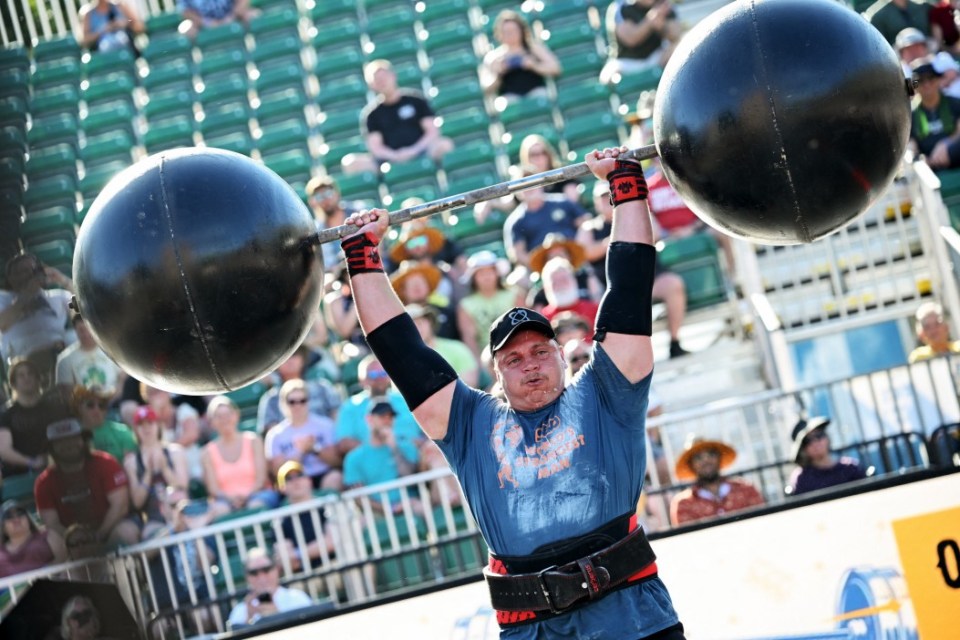 Rayno Nel of South Africa lifts a 154kg (340 lbs) circus barbell for two reps, during the Overhead Medley event on the first day of qualifying at the "World's Strongest Man" competition on May 15, 2025 in Sacramento, California. Some people think weightlifters are "a lot of angry people who just like to throw weight around," 420-pound (190-kilogram) Australian Eddie Williams told AFP, but "I can be, you know, a happy person, and still be able to lift heavy weights." (Photo by Robyn Beck / AFP) / -- IMAGE RESTRICTED TO EDITORIAL USE - STRICTLY NO COMMERCIAL USE -- (Photo by ROBYN BECK/AFP via Getty Images)