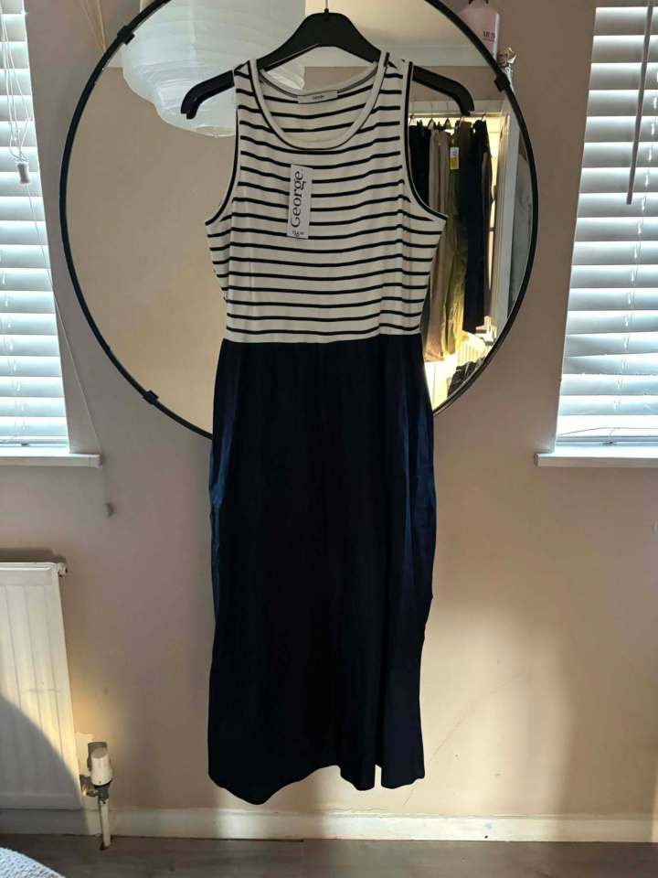 Striped midi dress on a hanger.