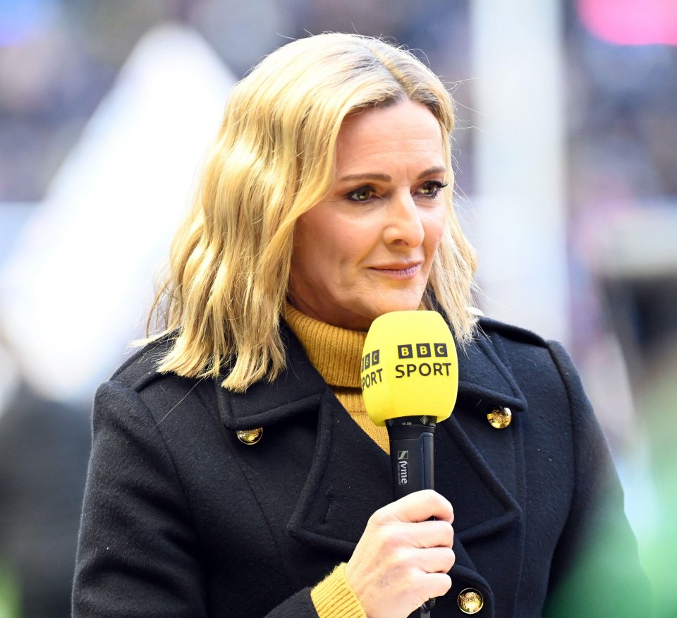 Gabby Logan, BBC Sport presenter, holding a microphone.