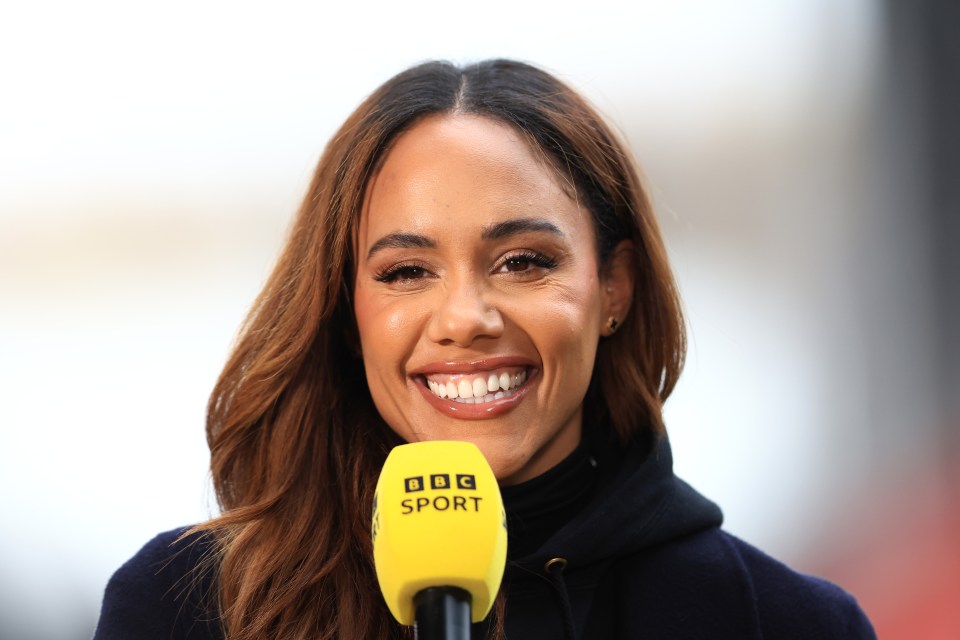 Alex Scott, BBC Sport presenter, smiling into a microphone.