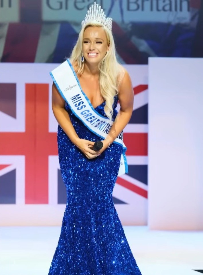 Miss Great Britain in a blue sequined gown, holding a microphone, discussing the negative effects of tanning nasal spray.