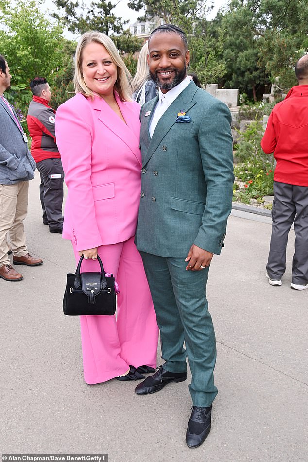 JB Gill looked dapper in a fitted suit as he cosied up to his wife Chloe - who looked radiant in a hot pink trouser suit