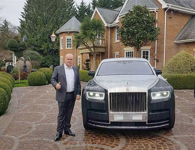 Multi-millionaire residential park owner 'Fred' Doe Senior, pictured with a luxury car, previously claimed his son may have been 'victimised' because of the family name and his gypsy roots