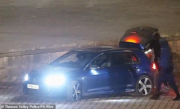 The gang, armed with sledgehammers and crossbars, bundling the £4.8million toilet into the back of a car
