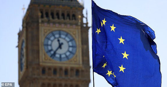 epa12064647 The EU flag flies outside the British parliament in London, Britain, 30 April 2025. The United States has warned that Britain's Brexit reset with the European Union (EU) may reduce the chance of a future trade deal with Washington.  EPA/ANDY RAIN