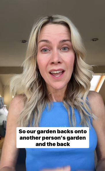 Woman in blue tank top explaining that her garden backs onto another person's garden.
