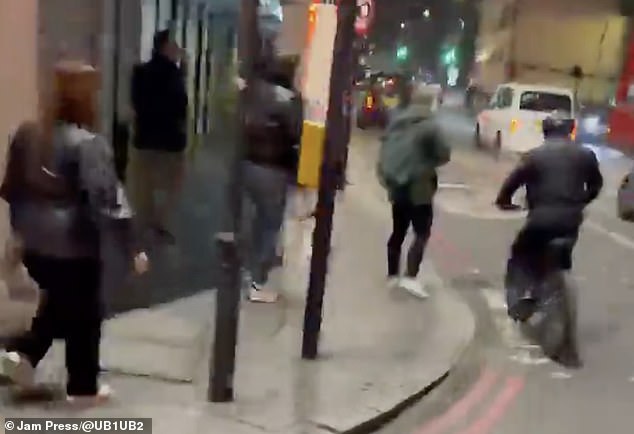 It appeared as if the victim was about to cross the road when the main culprit, clad in black, snatched the phone from his bag