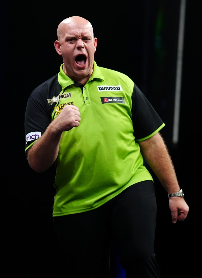 Michael van Gerwen celebrating during a darts match.