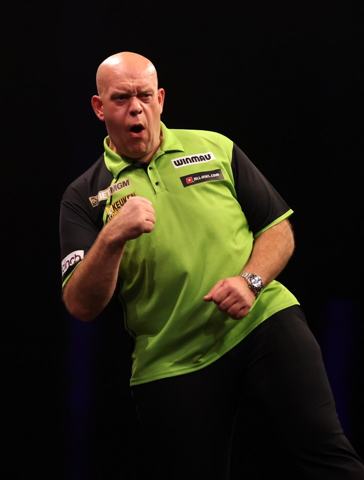 Michael van Gerwen celebrating at a darts match.
