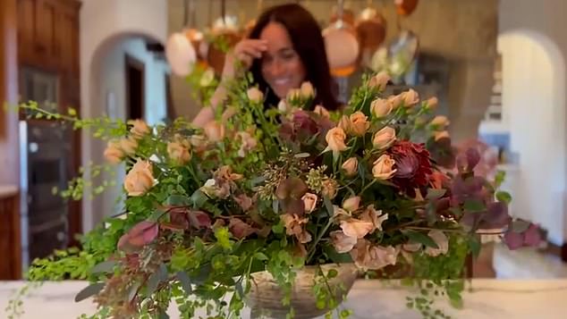 Meghan assembles the roses and various greenery into a beautiful floral arrangement on her Netflix show