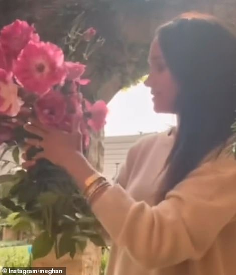 As the lyrics 'doing it well' played on repeat in the background, Meghan showed off her flower arrangement skills - a hobby she finds 'calming and meditative'