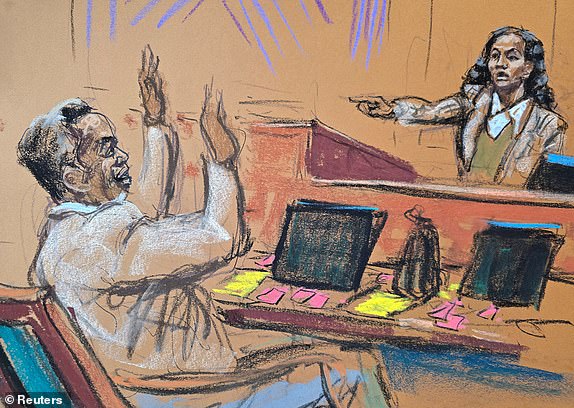 Sean "Diddy" Combs raises his hands as he is pointed out by Dawn Richard, during Combs' sex trafficking trial in New York City, New York, U.S., May 16, 2025 in this courtroom sketch. REUTERS/Jane Rosenberg