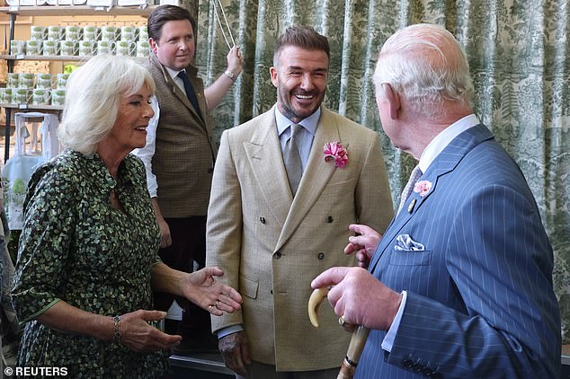The retired football player appeared in good spirits as he chatted with the royal couple - with whom he's spent much time in recent years