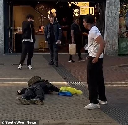 The victim was seen being floored by a single blow in front of terrified shoppers in Birmingham city centre yesterday