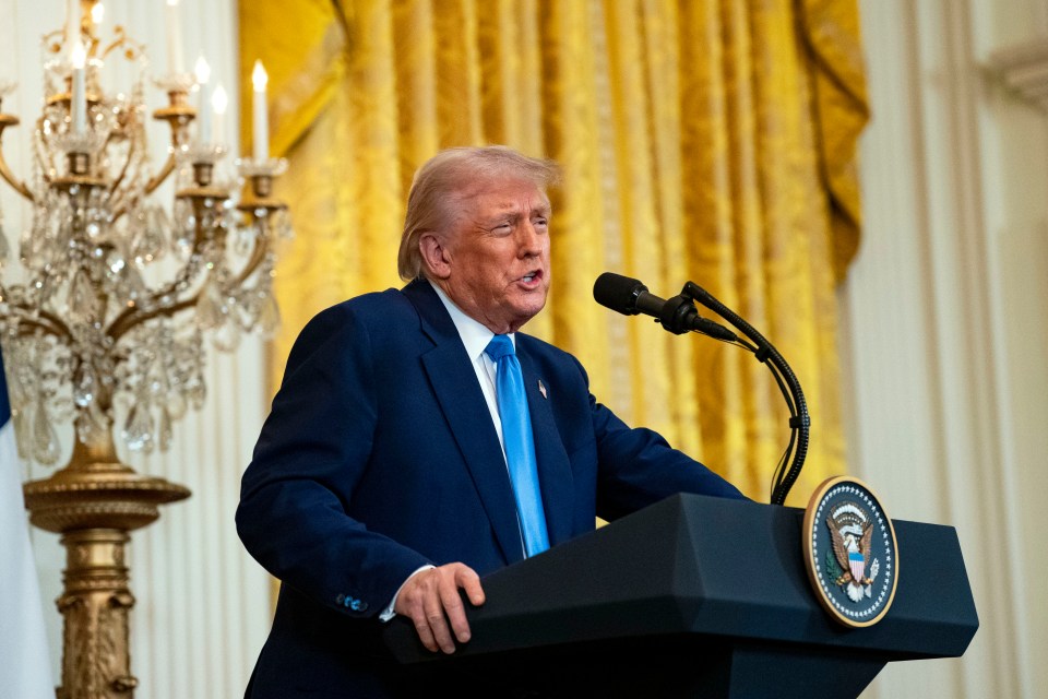 President Donald Trump speaking at a podium.