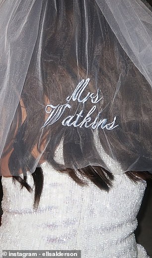 Alderson wore an embroidered veil featuring the words 'Mrs Watkins' during the evening