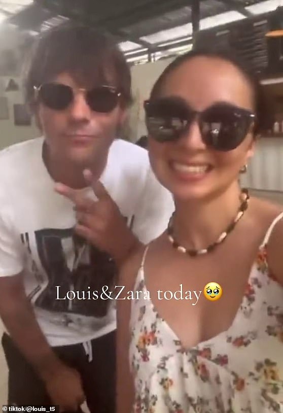 The lovebirds are enjoying a sun-soaked holiday in Santa Teresa, where Louis is currently recording music (Louis pictured posing for a selfie with a fan)