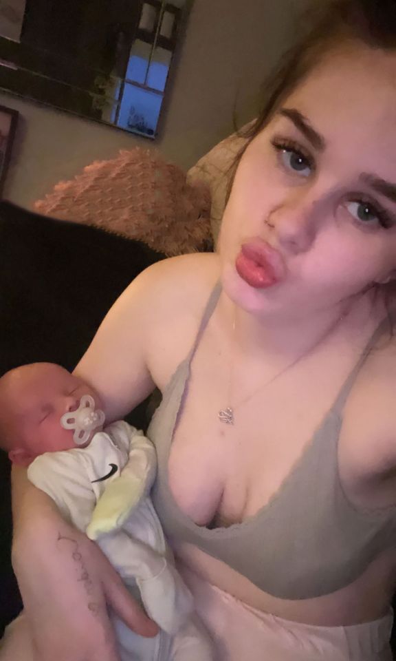 A young mother holding her baby.