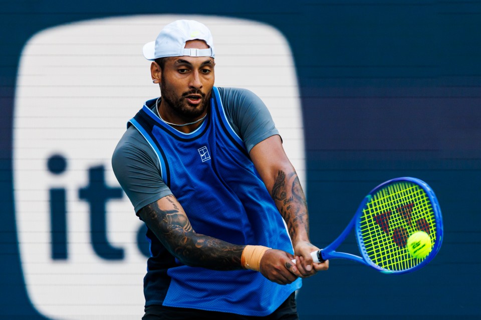 Nick Kyrgios of Australia hitting a backhand during a tennis match.