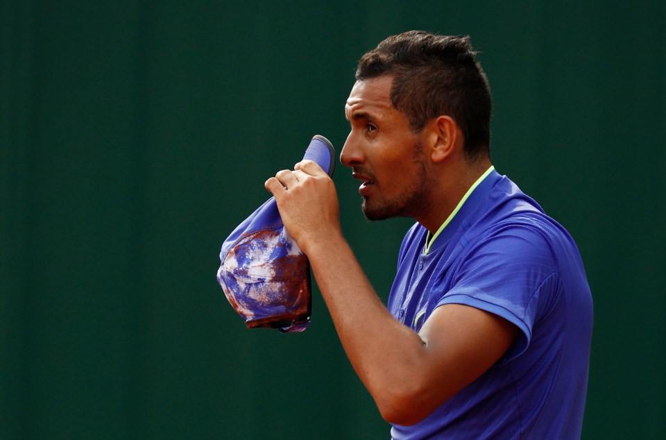 Nick Kyrgios returning a tennis ball.