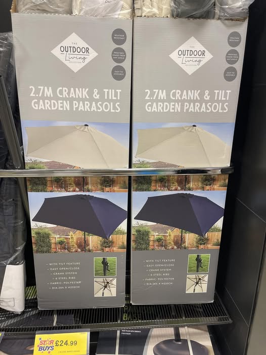 Two boxes of 2.7m crank and tilt garden parasols.