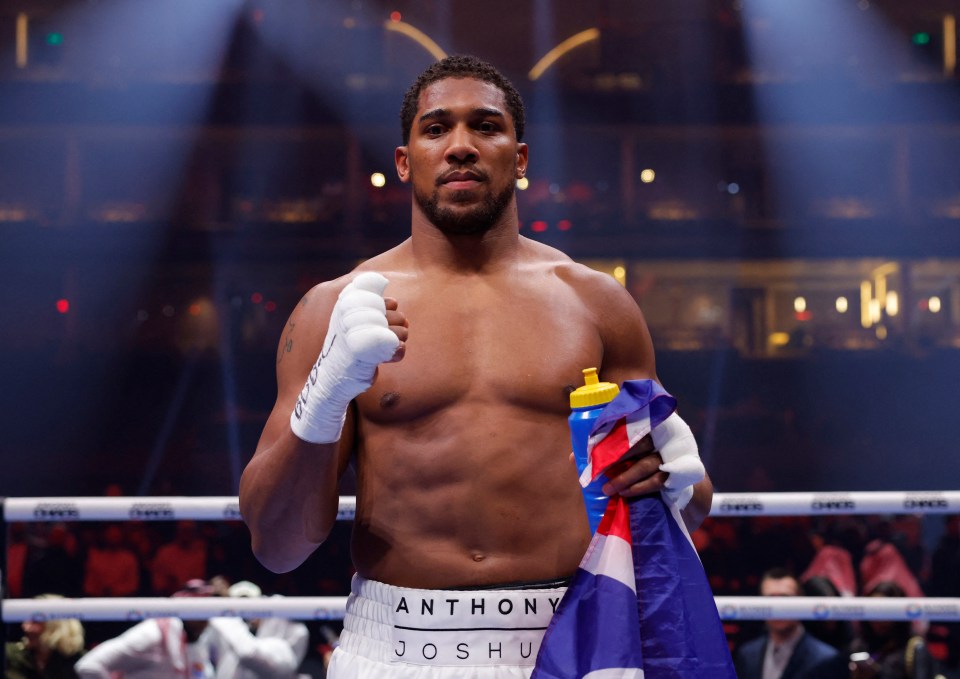 Anthony Joshua victorious in boxing match.