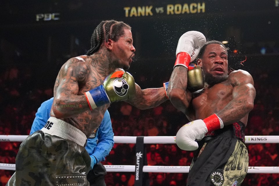 Gervonta Davis punches Lamont Roach in a boxing match.