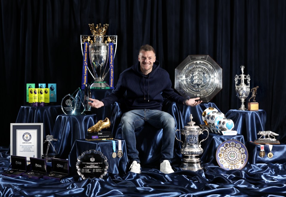 Jamie Vardy sitting among his trophies.