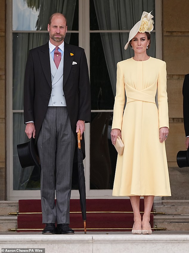 The Prince and Princess of Wales stand at the top of the Garden steps before the start of a Royal Garden Party