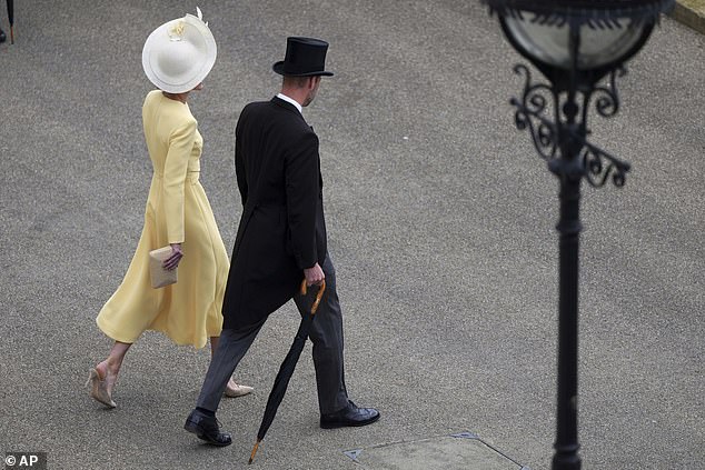 Britain's Prince William and Kate, the Princess of Wales, arrive to attend The King's Garden Party at Buckingham Palace in London
