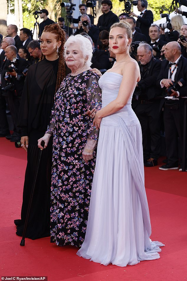 She swept her golden tresses back into a sleek up-do as she posed alongside American actress June Squibb (centre) and Erin Kellyman (left)