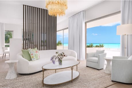 Living room with ocean view in a luxury beach mansion.