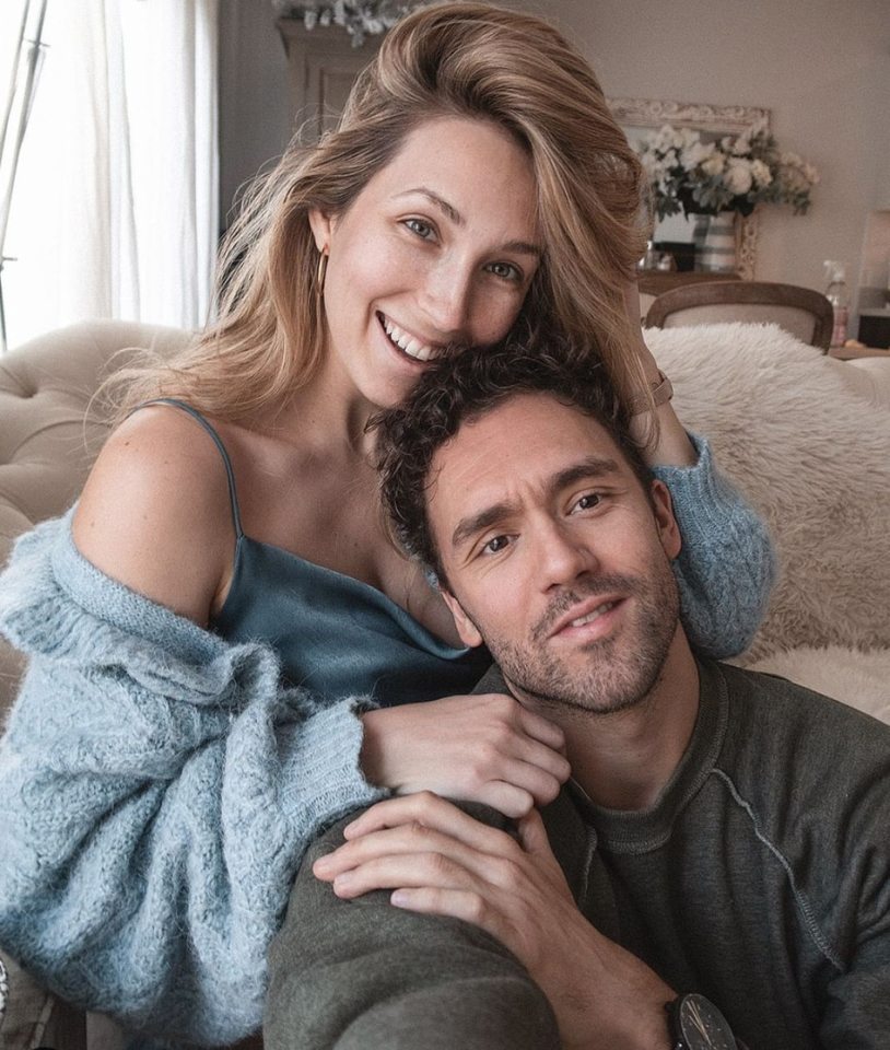 Couple embracing on a couch.