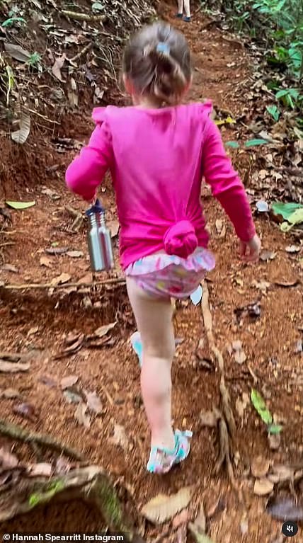 Hannah wrote in the video caption: 'Morning walks down to the waterfall¿ trying to keep up with the little legs!'